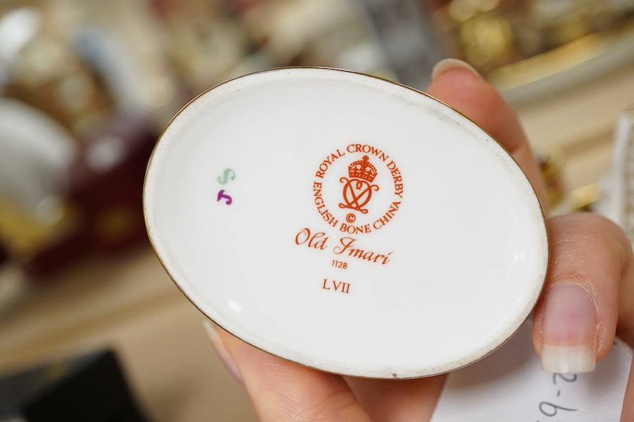 A small collection of Royal Crown Derby miniature tea for two and a pill box, tray 19cm wide. Saucer missing on tea for two.